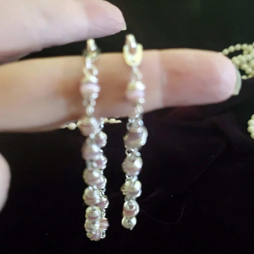 Two silver with pink pearl stones